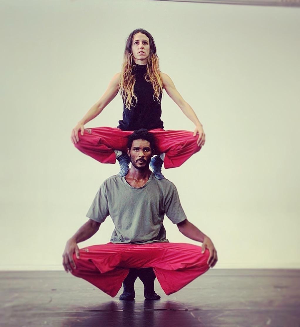 Julia Robert and Rudi Cole in the studio, one balanced on the other's shoulders
